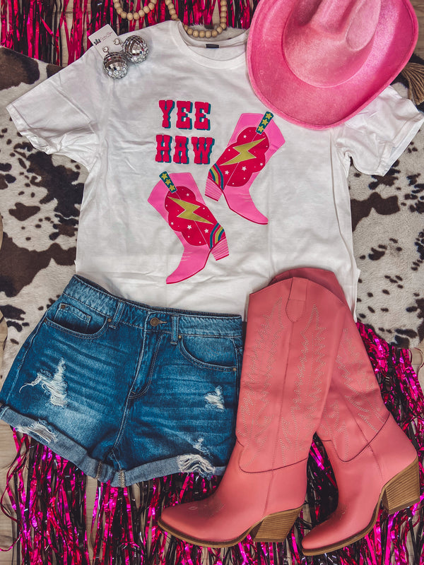 White printed graphic tee with pink "Yee Haw" and cowgirl boots printed on it